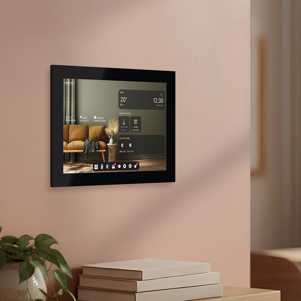 Black smart touch panel mounted on a wall, showing room info and favorite devices